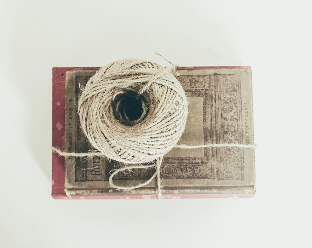Stack of old case files and folders tied with string