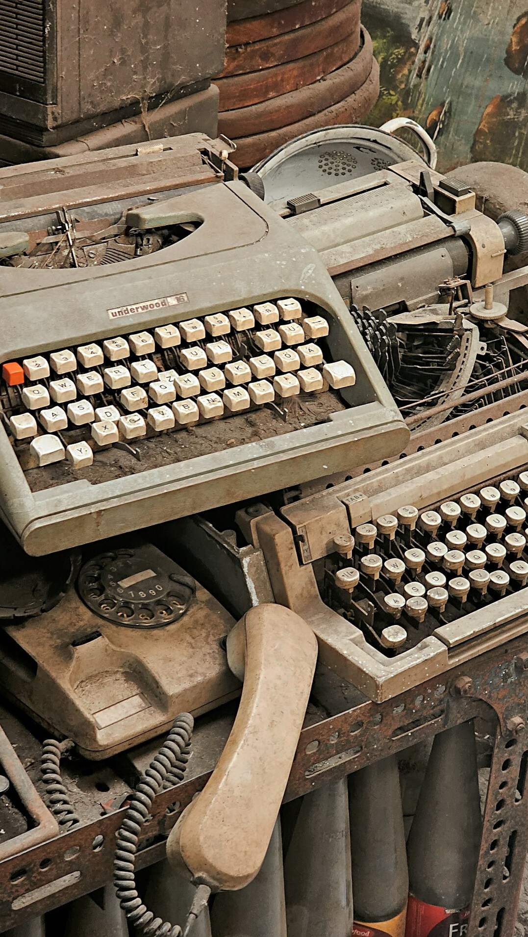 Vintage typewriter with stacked documents and an old map