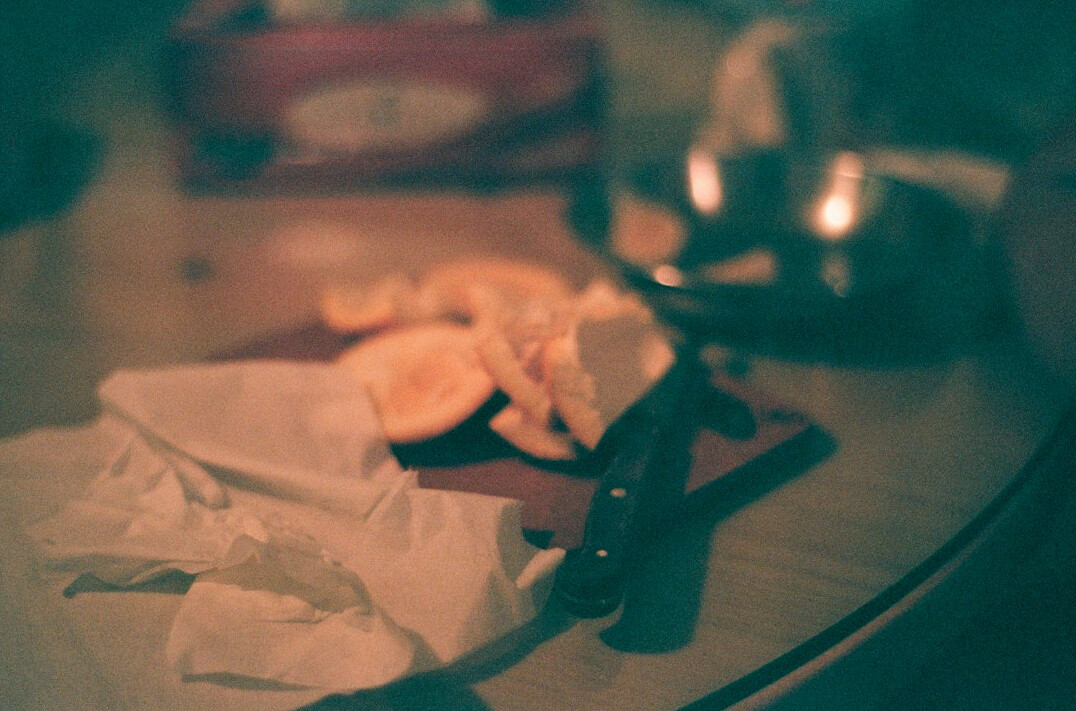 Old sepia toned photographs and letters on a wooden table