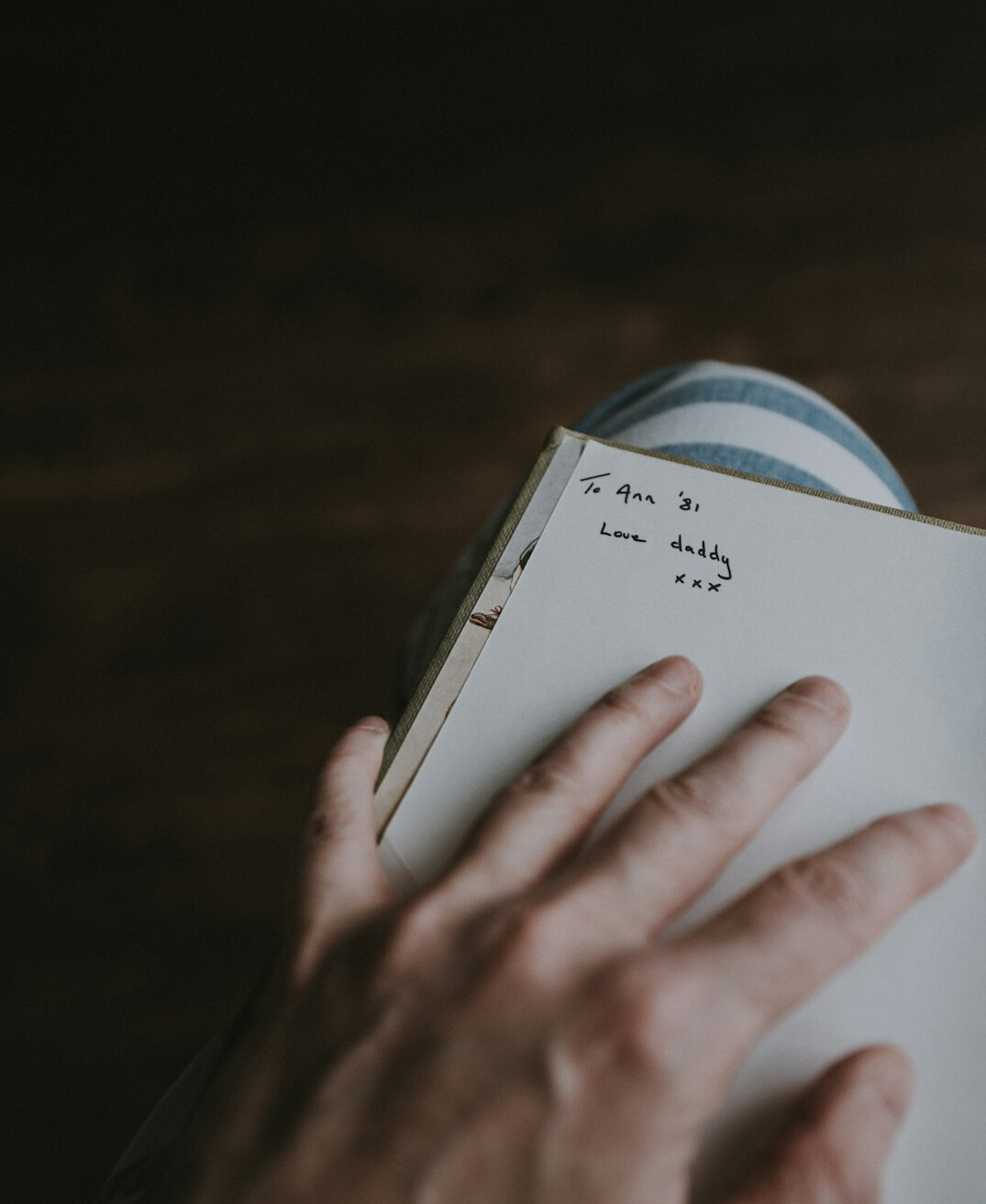 Uruguayan writer working at a desk with a notebook and pen