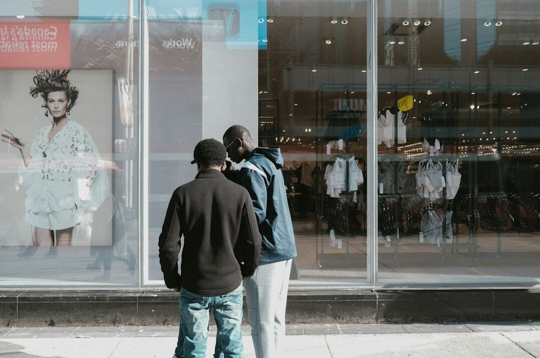 store detective watching shoppers