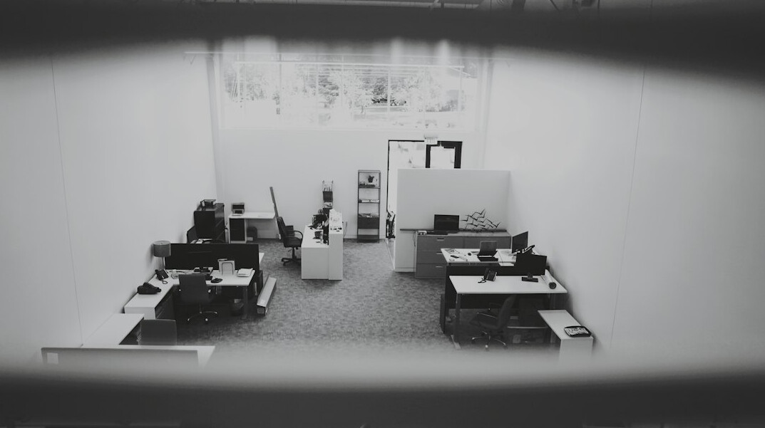 store detective watching surveillance