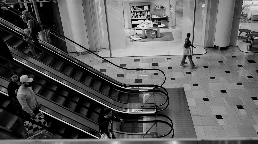 detective watching suspect in mall